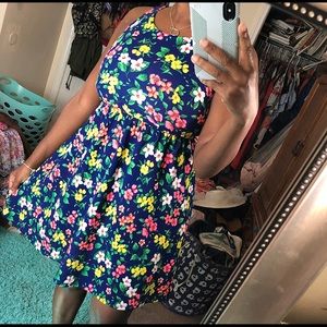 A bright, multicolored, floral printed dress